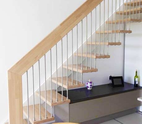 straight flight light wood open staircase with white wall stringer