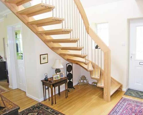timber floor in a hallway with a quarter timber staircase with open risers