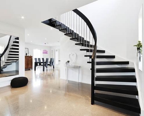 black floating timber staircase with open risers