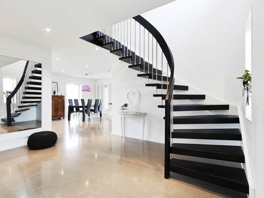 black floating timber staircase with open risers