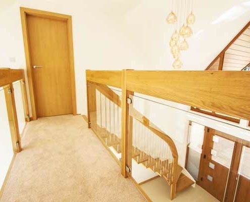 carpeted walkway with glass balustrade to both sides
