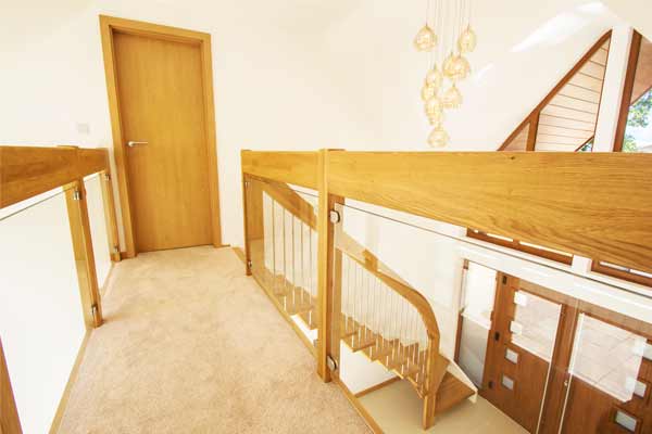 carpeted walkway with glass balustrade to both sides