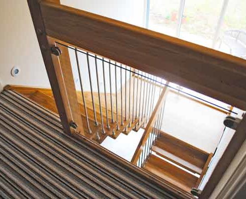 glass landing balustrade above a half turn oak stair