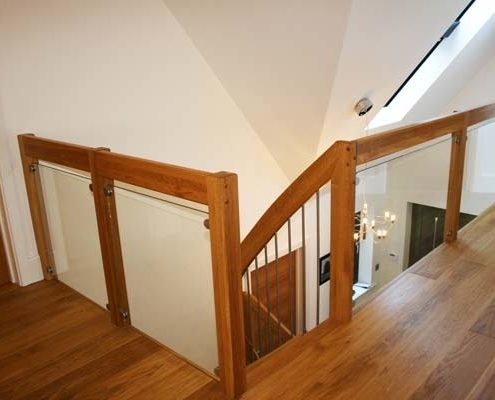 landing balustrade with glass panels around a stairwell