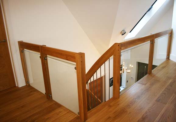 landing balustrade with glass panels around a stairwell