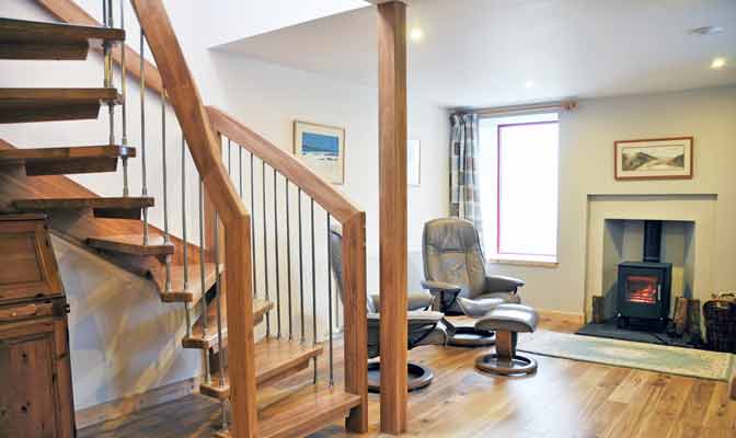 floating oak staircase in a living room