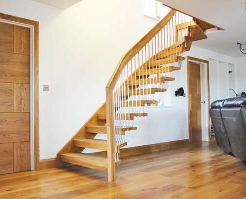 oak floor and white wall with floating staircase