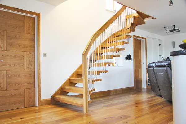 oak floor and white wall with floating staircase