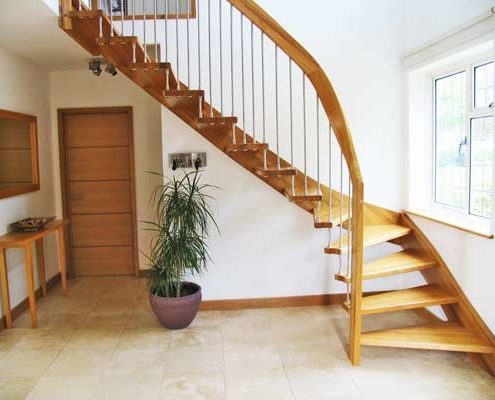 quarter turn oak staircase with tiled floor below