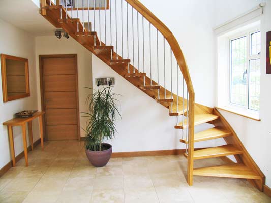 quarter turn oak staircase with tiled floor below