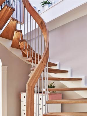 twisting handrail on an open riser stair