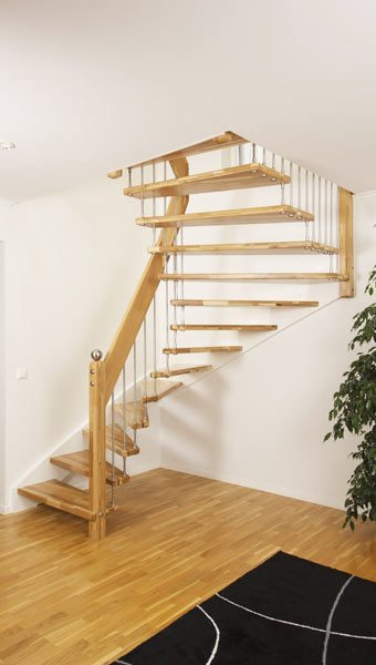 floating staircase with open treads with white wall background