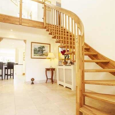tiled floor and oak staircase ascending