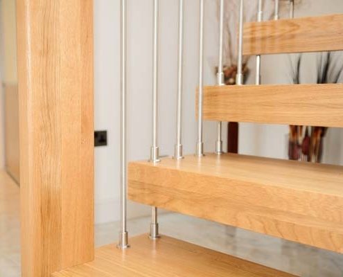 close up of a wooden step on a floating staircase