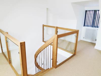 landing balustrade with glass panels around a stairwell