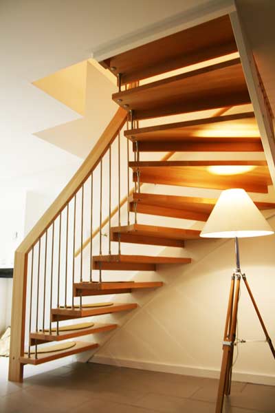 underneath an open floating timber staircase