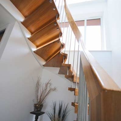 close up of timber handrail on a floating staircase