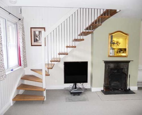 white and dark wood timber staircase with open risers