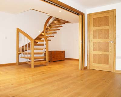 oak floor and oak door with floating oak stair to rear