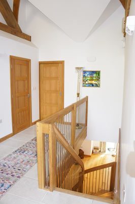 stairwell with oak balustrade and stainless spindles