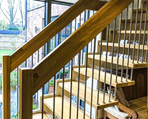 handrail and staircase and window behind