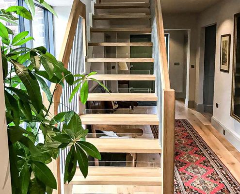straight flight open staircase with rug to side