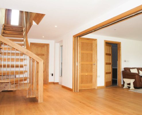 oak staircase with open risers on an oak floor