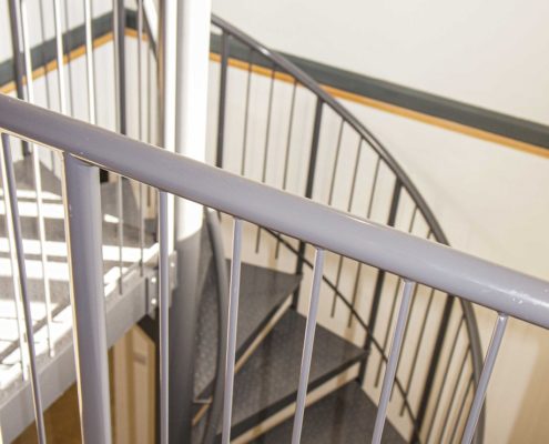 landing balustrade in grey steel with spiral behind