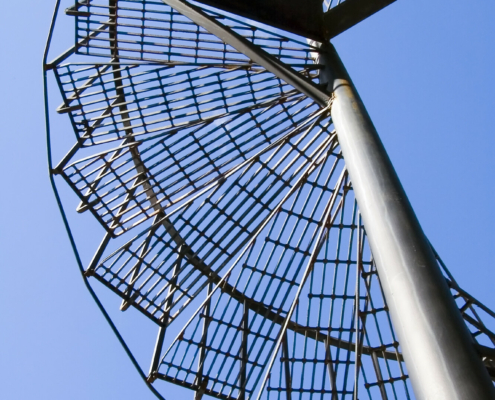Spiral,Staircase,To,Platform,And,Blue,Sky