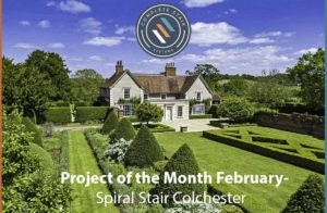 well kept gardens and woodland with large house