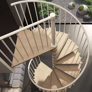 looking down on a spiral stair with light wood steps