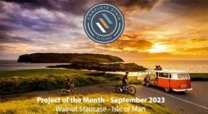 sunset scene in Isle of Man with campervan overlooking the sea and island beyond