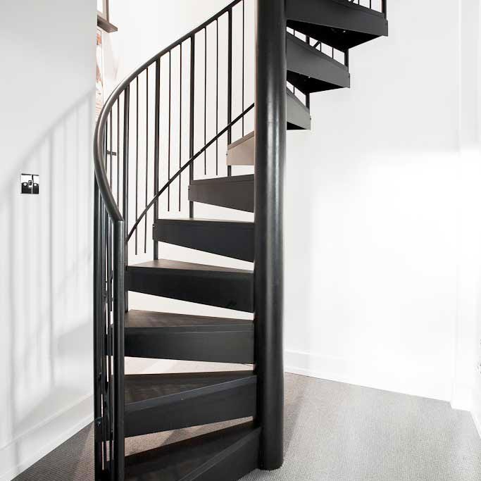 Loft-Spiral-Staircase with black steps with white walls