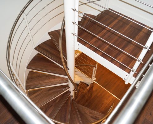 plan view of a walnut tread and white spiral staircase