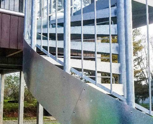 close up of the side view of a galvanised outside spiral stair