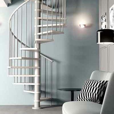 living space with light blue wall and soft seat with spiral staircase in light timber