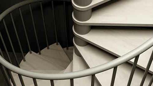 looking down on the light wooden steps of the C20 spiral staircase