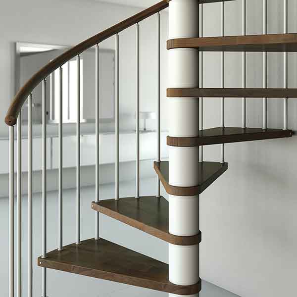 lower front view of c20 spiral stair with dark wood steps and white steel structure. Living space behind