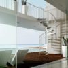 outdoor white spiral staircase with ocean behind