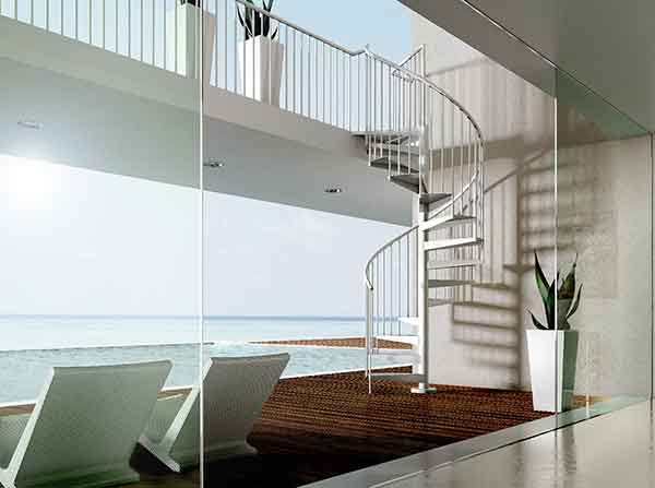 looking through window to the sea with outside spiral staircase rising to walkway
