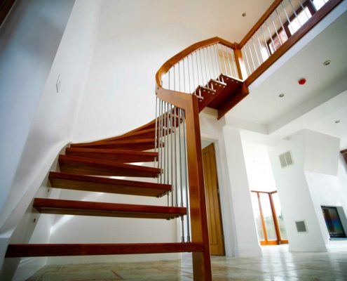 grand staircase in wood in hallway