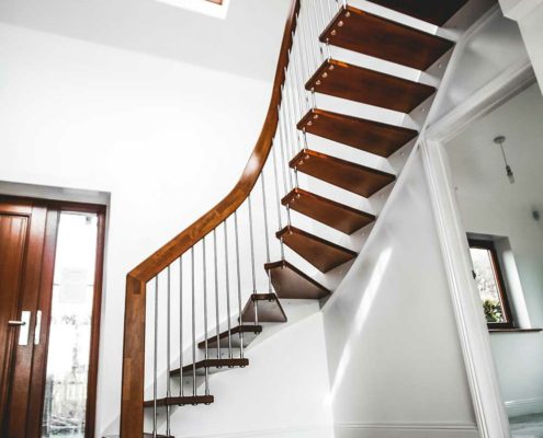 hallway with large floating stair