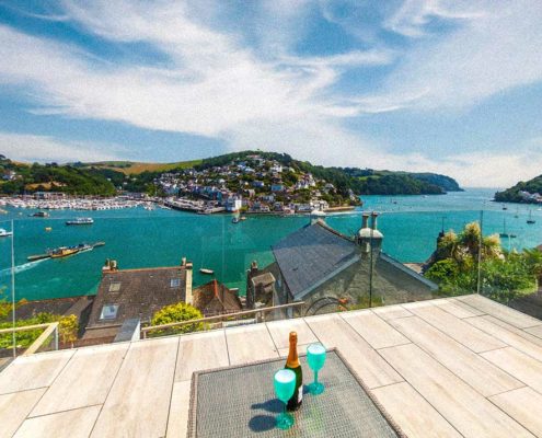 looking out across the Dartmouth estuary, sea and misty blue sky