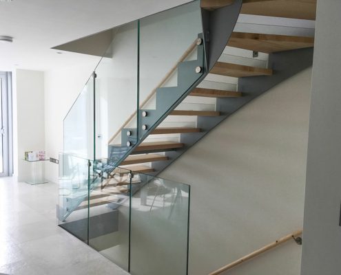 side view of modern stair in a house with steel and glass