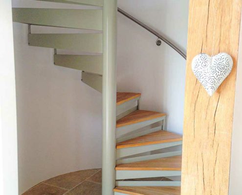oak beams framing a oak tread spiral stair