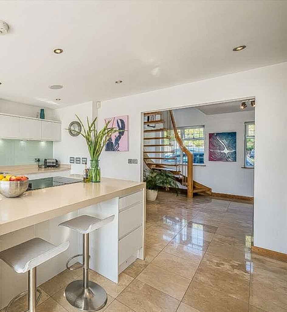 kitchen worktop with hallway and open stair beyond