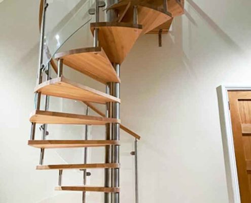underside view of spiral stair with wood steps
