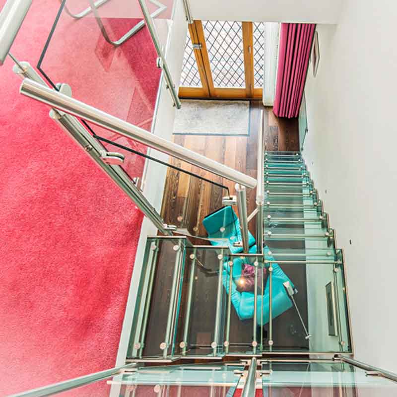 looking down on a glass step on a glass stair